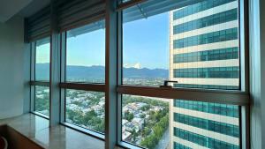 a view of a city from an office building at Centaurus Apartment Mountain View Two Beds in Islamabad