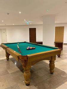 a pool table sitting in a room with afits at Ośrodek Magnolia in Ustroń
