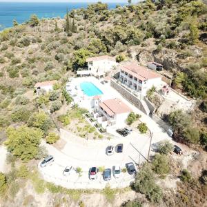 an aerial view of a house with a swimming pool at Poros View in Galatas