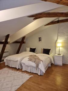 a bedroom with two beds in a attic at Cosy Apartment in heart of Stockholm Sweden in Stockholm