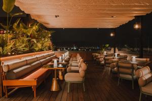 a row of tables and chairs in a restaurant at Nobu Hotel Barcelona in Barcelona