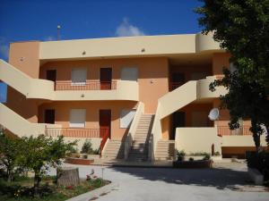 a building with stairs in front of it at Stella di Mare Appartamenti in Marsala