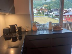 Kuchyň nebo kuchyňský kout v ubytování Apartment Margherita