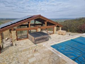an overhead view of a house with a swimming pool at Vinársky dom u kríža in Vrádište