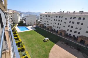an apartment with a lawn in the middle of a building at DUPLEX COMFORT MIL.LENI ROSES -HUTG-026971 in Roses