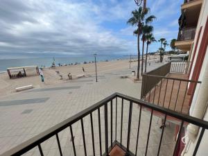 a view of the beach from a balcony of a condo at El Bull de Baix a Mar in Torredembarra