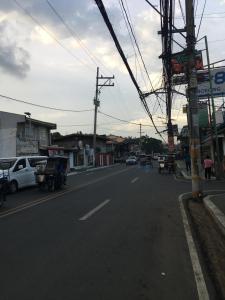 a street with cars driving down the road at Apartment in Rizal short stay only in Teresa
