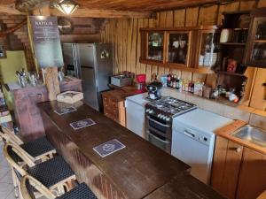 a kitchen with a counter and a stove top oven at Agroturystyka Kajaki Sauna Pierogi in Bakałarzewo