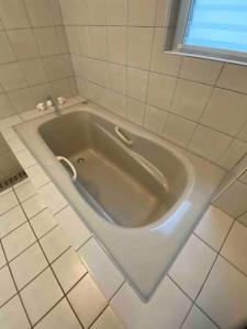 Vannituba majutusasutuses 貸切別荘カリイ Vacation Rental KALLY Naha Okinawa