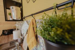 a kitchen counter with a sink with a towel on it at Waterfall A Frame, Maramures in Baia Mare