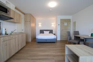 Postel nebo postele na pokoji v ubytování Smart & Stay Aparthotel Saarlouis Lisdorf - Self-Check-In - Free Parking
