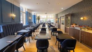 Een restaurant of ander eetgelegenheid bij Atlas Hotel