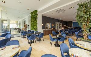 Een restaurant of ander eetgelegenheid bij Atlas Hotel