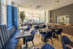 Een restaurant of ander eetgelegenheid bij Atlas Hotel
