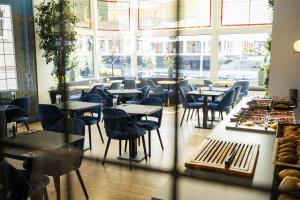 Een restaurant of ander eetgelegenheid bij Atlas Hotel