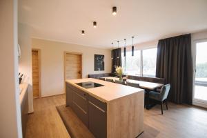 A television and/or entertainment centre at Das Lenz by Inncomer