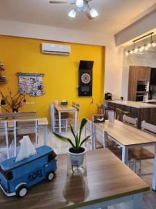 a dining room with a table with a toy truck on it at Lang duo duo Homestay in Huxi
