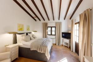 Posteľ alebo postele v izbe v ubytovaní Finca Can Coll Boutique Country House - Adults Only