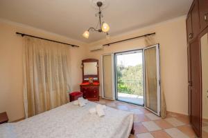 Ένα ή περισσότερα κρεβάτια σε δωμάτιο στο Villa Sofia