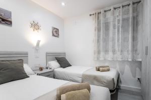 Posteľ alebo postele v izbe v ubytovaní Sur Suites Principe