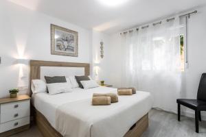 Posteľ alebo postele v izbe v ubytovaní Sur Suites Principe