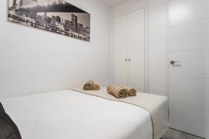 Posteľ alebo postele v izbe v ubytovaní Sur Suites Principe