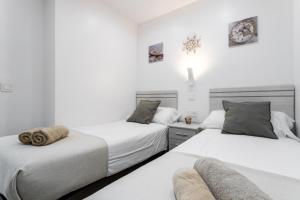 Posteľ alebo postele v izbe v ubytovaní Sur Suites Principe