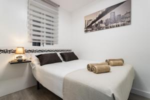Posteľ alebo postele v izbe v ubytovaní Sur Suites Principe