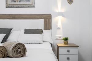 Posteľ alebo postele v izbe v ubytovaní Sur Suites Principe