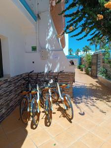 a group of bikes parked next to a building at Residence Family OULANTI in Martil