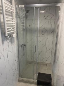 a shower with a glass door in a bathroom at Mega widok 2 in Szklarska Poręba +10 photos