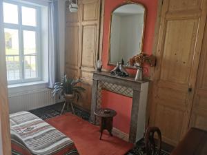 Ένα ή περισσότερα κρεβάτια σε δωμάτιο στο Le Clos du Hesdre