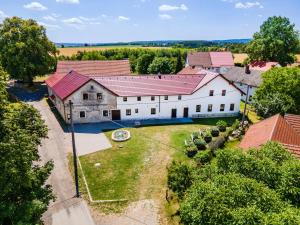 an aerial view of a large white house with red roofs at Statek Biobýt 