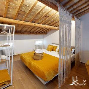 a bedroom with a bed in a room at La Bricola - Sirocco e Garbin in Chioggia