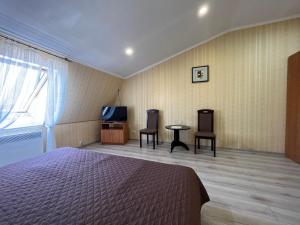 Postel nebo postele na pokoji v ubytování Barvy Dnipra