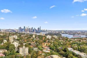 a view of a city with a city skyline at Iconic Sydney Harbour Bridge view in Sydney