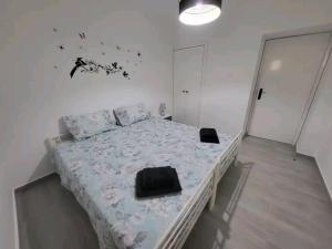 Uma cama ou camas num quarto em The Believers - Porto Santo
