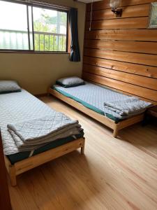 Un pat sau paturi într-o cameră la Yoshino-gun - House - Vacation STAY 61738v