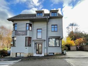 a large white house sitting on top of a street at Aqua City Suite by Malmedreams in Malmedy