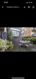 two photographs of a patio with a table and benches at STUDIO IN BONDI in Sydney