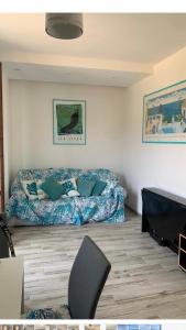 a bedroom with a bed and a chair in it at argentario home in Porto Santo Stefano