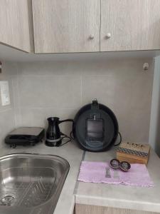 Kuchyň nebo kuchyňský kout v ubytování Athinais Karystos