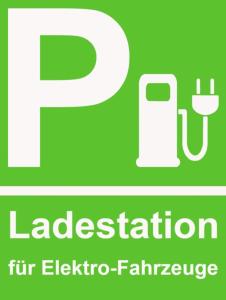 a green parking sign with the words ladestation flu epidemic at Zur Post Kümmersbruck Hotel & Tiny Houses in Kümmersbruck