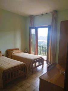 Letto o letti in una camera di Albergo Grumentum