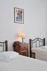 Ein Bett oder Betten in einem Zimmer der Unterkunft Eri Hotel