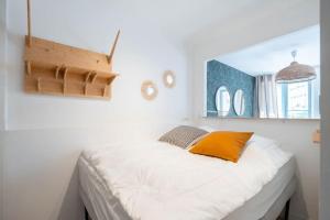 Posteľ alebo postele v izbe v ubytovaní T2 - Rue de la République - Cosy