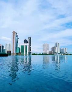 a large body of water with a city in the background at KSL City Mall D'esplanade Muji Style Studio in Johor Bahru