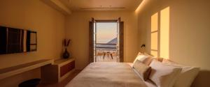 Ένα ή περισσότερα κρεβάτια σε δωμάτιο στο Elessa Hotel