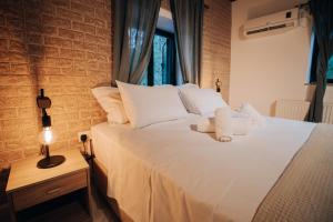 Letto o letti in una camera di Pine View Boutique Hotel Adults Only