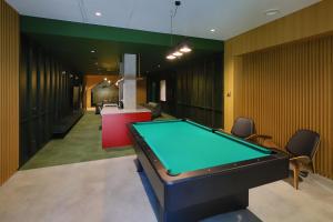 a billiard room with a pool table in it at Młyny Gdańskie Apartment with Terrace, Gym & Playground by Renters in Gdańsk